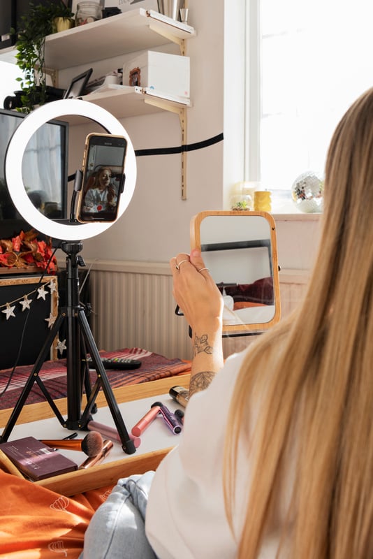 Vlogger with Scoliosis Recording a Video on Her Phone